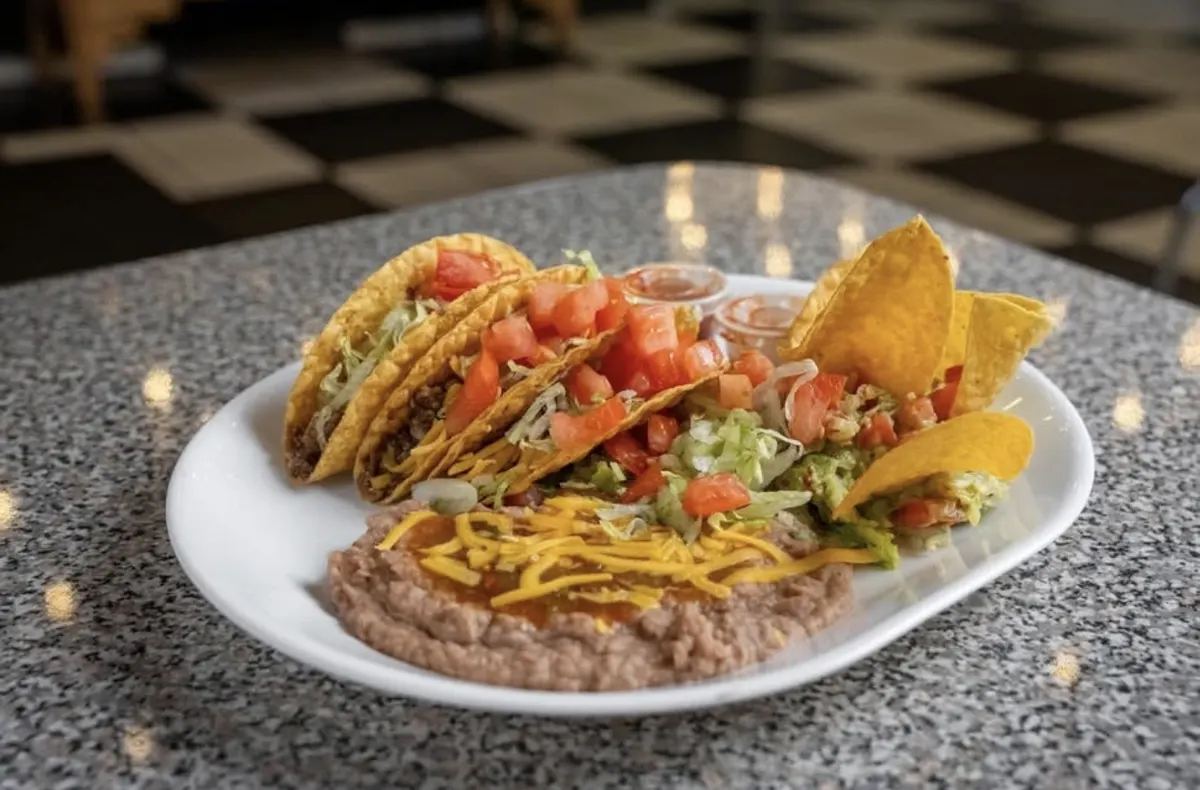 Crispy beef tacos with beans and chips
